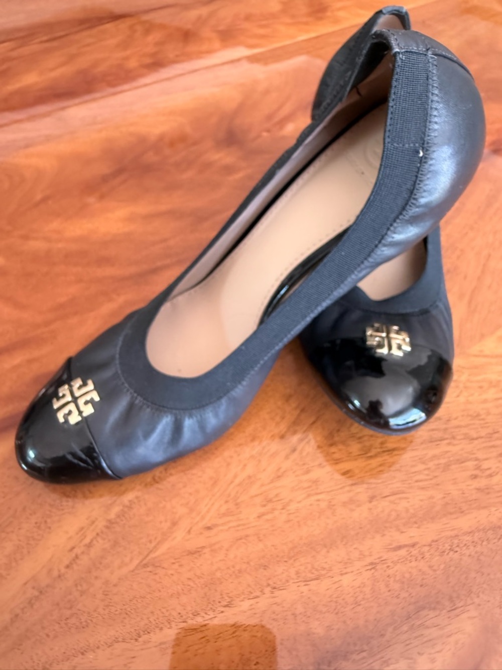 Tory Burch Black Leather Ballet Flats with Patent Cap Toe and Gold Logo